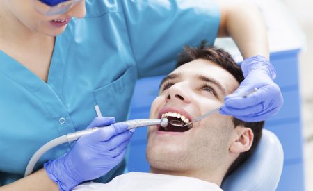 Man having teeth examined at dentists